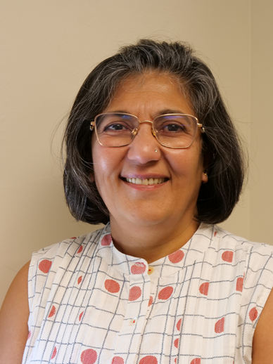 photo of woman in white dress with blue line graph pattern and red dots